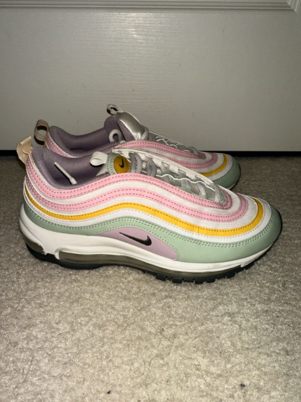 Nike sneakers in pastel pink, mint green and pale yellow